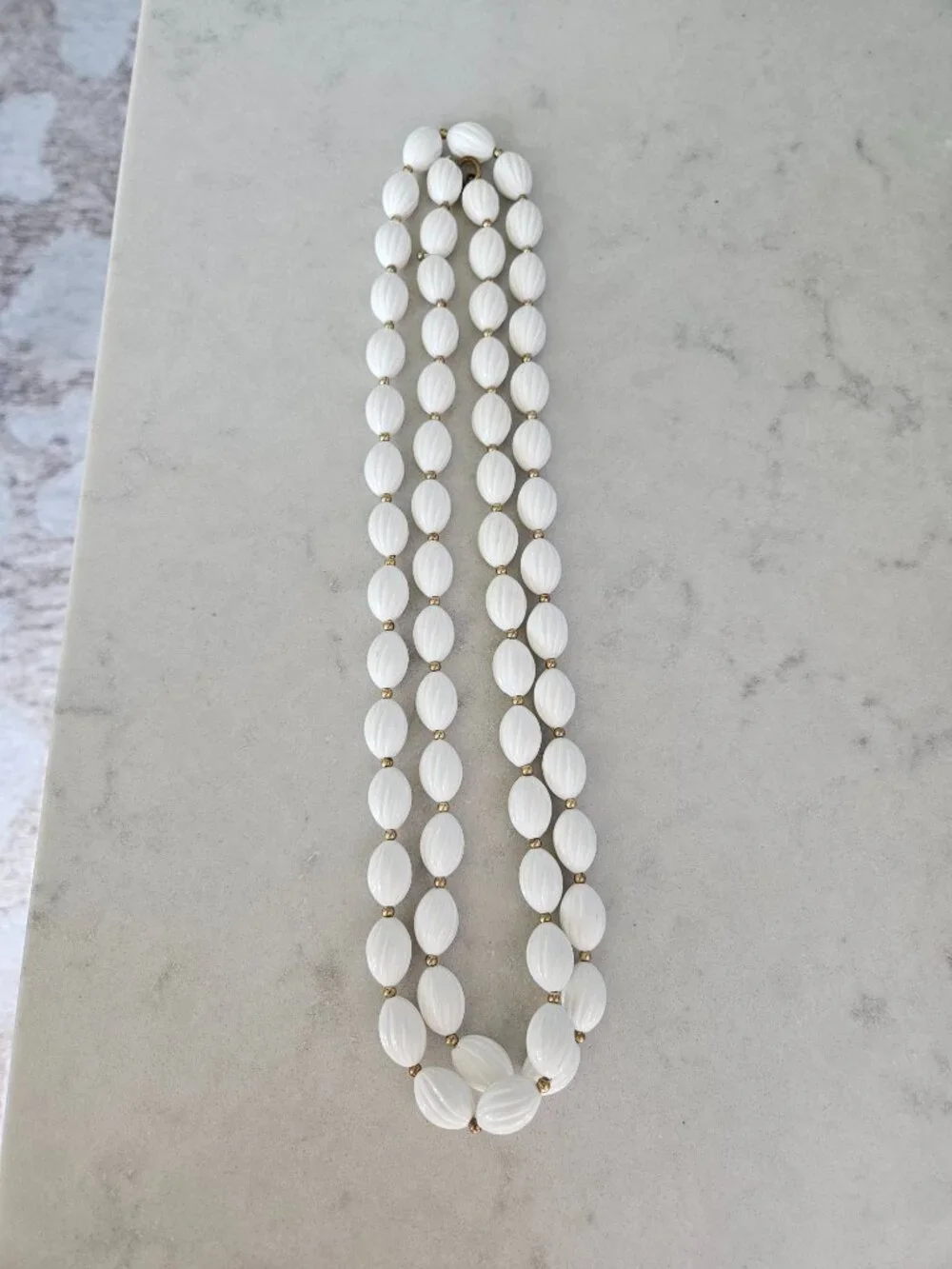 RARE AND VINTAGE WHITE RIBBED OVAL BEAD 48